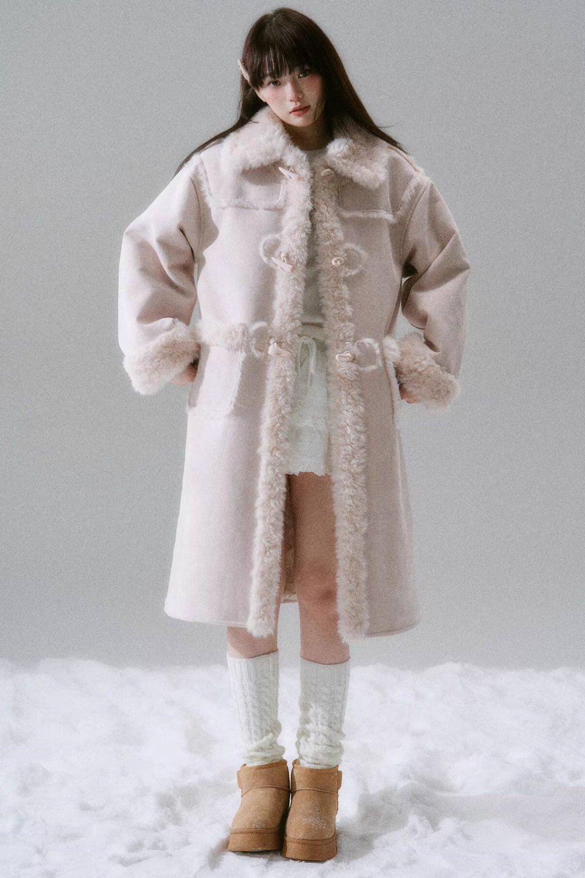 Manteau long à boutons en corne