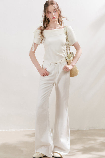 Top in maglia con spalle scoperte e fiocco in pizzo
