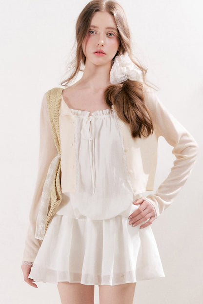 Cardigan in maglia trasparente 100% Lyocell con bordo in pizzo