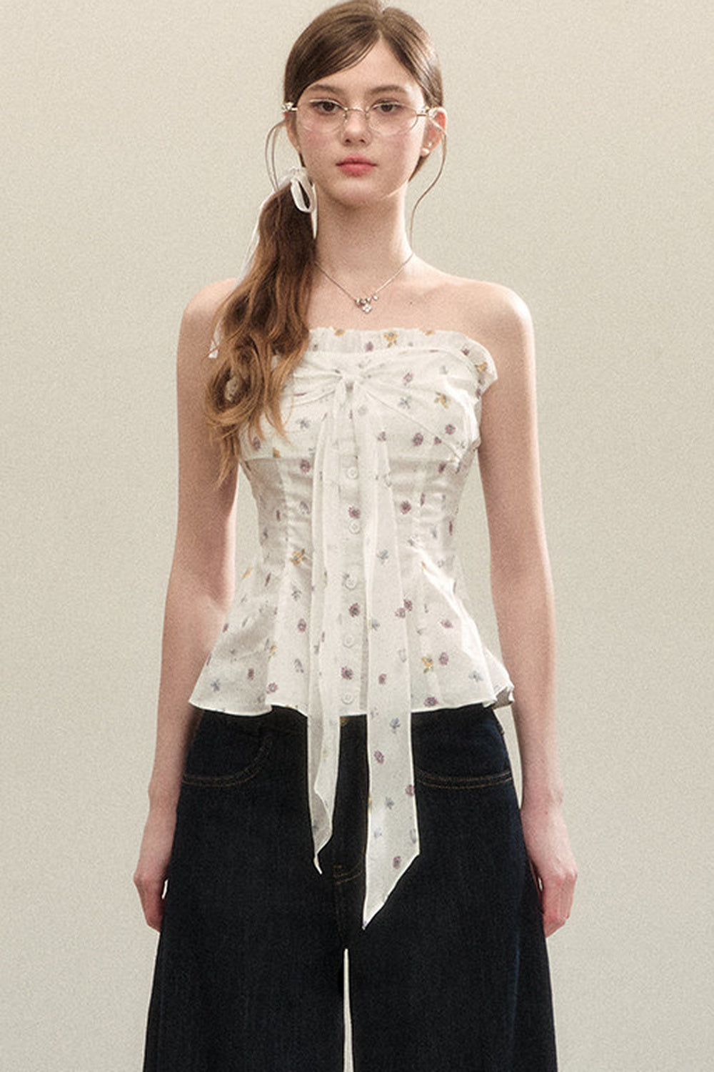 Top a fascia con peplo e fiocco