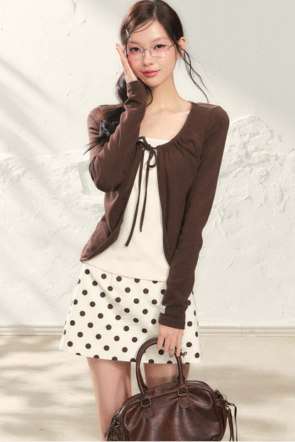 Conjunto de top de punto de manga larga y falda