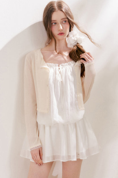 Cardigan in maglia trasparente 100% Lyocell con bordo in pizzo