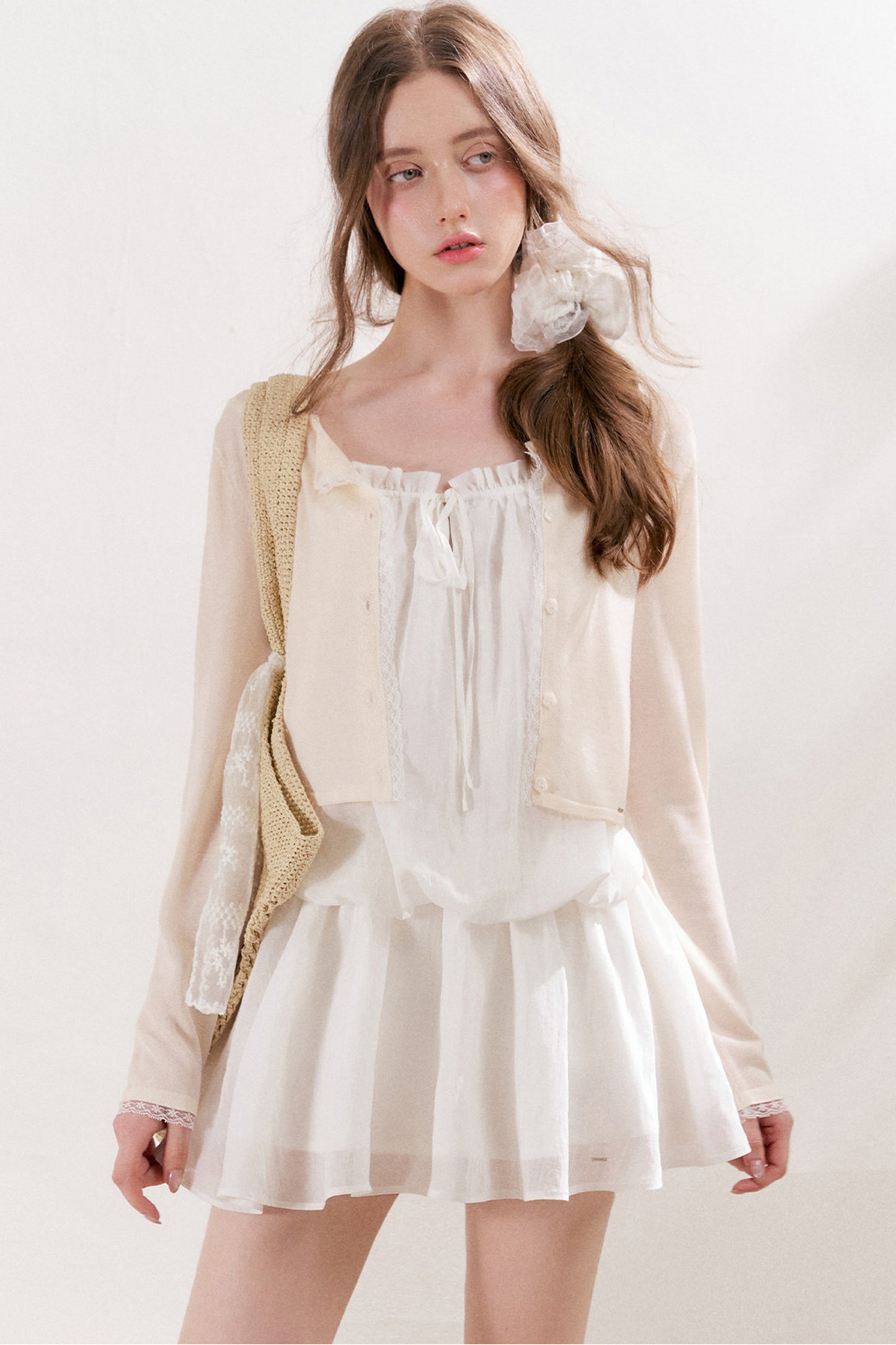 Cardigan in maglia trasparente 100% Lyocell con bordo in pizzo