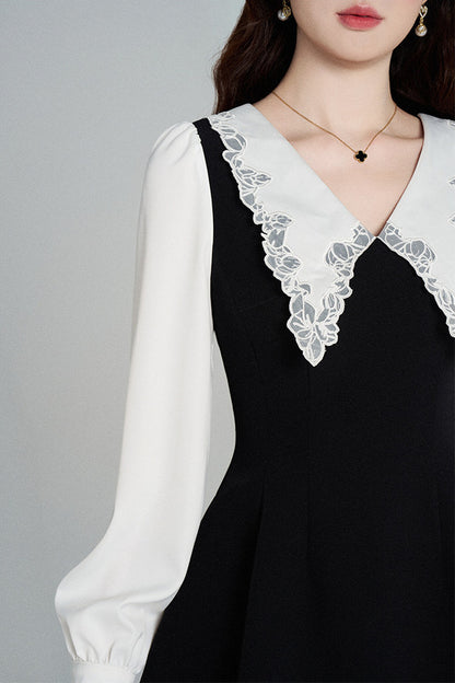 Schwarzes A-Linien-Kleid mit Bubikragen und tailliertem Schnitt