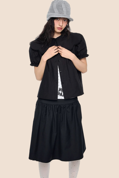 Blusa con cuello de encaje y mangas abullonadas