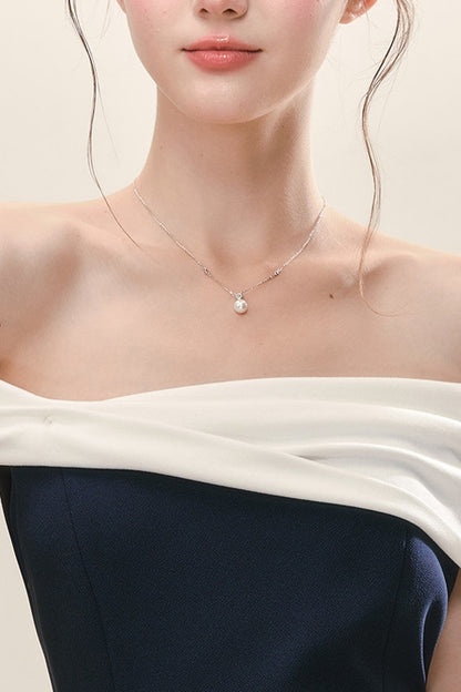 Top peplo a fascia con spalle scoperte