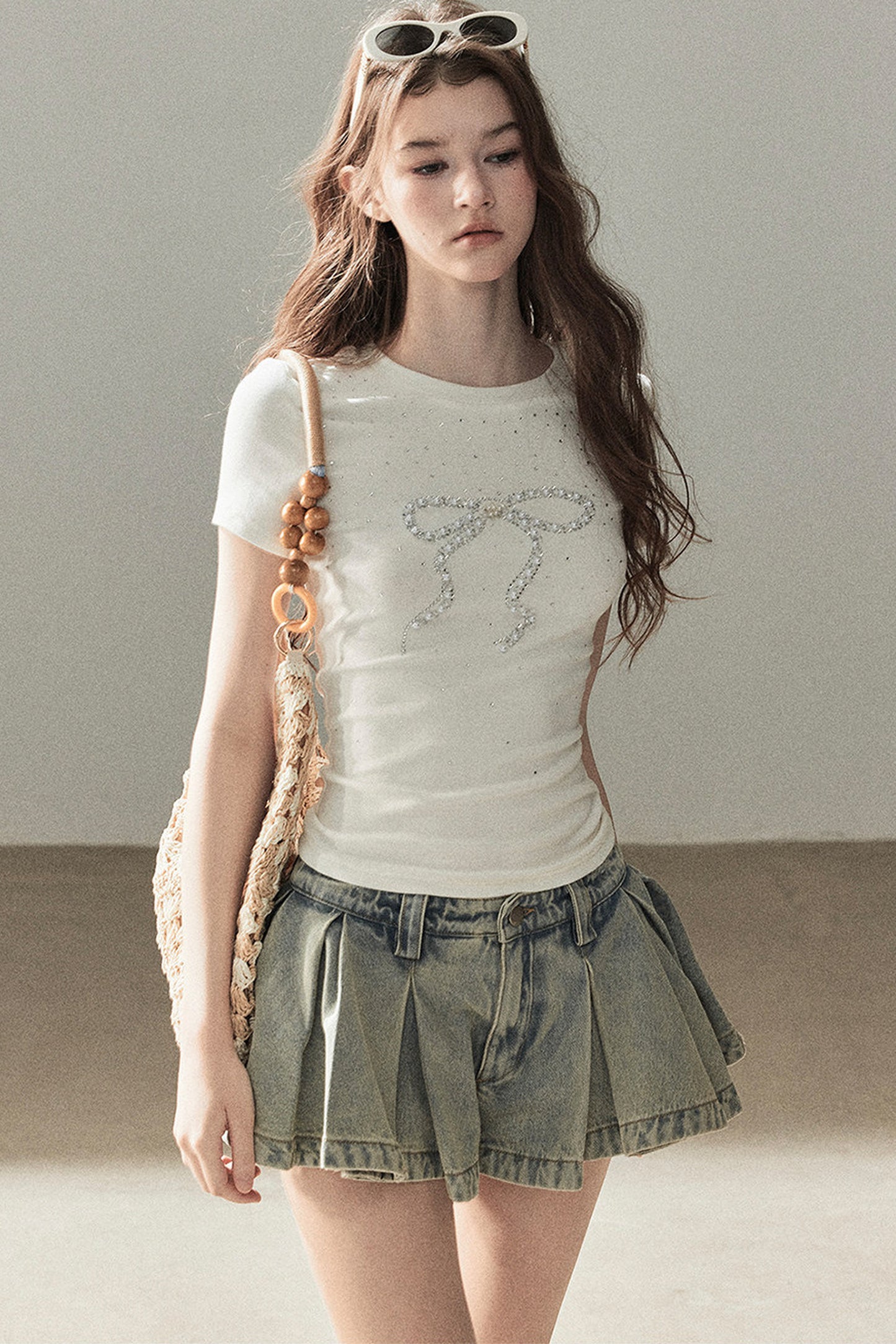 T-shirt a maniche corte con fiocco di strass