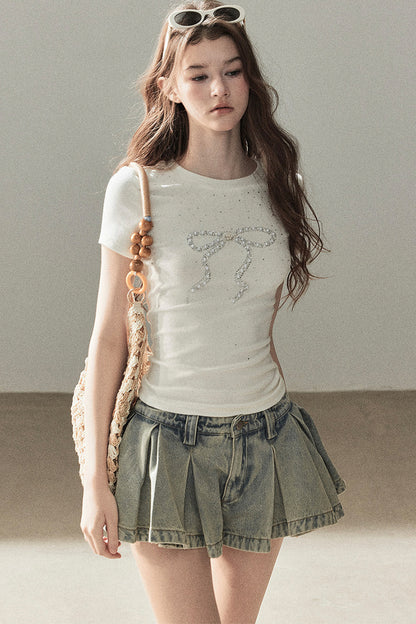 T-shirt a maniche corte con fiocco di strass
