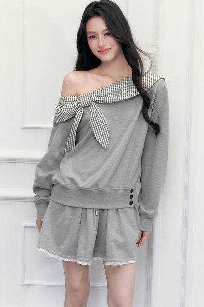 Ensemble sweatshirt épaules dénudées et jupe patchwork à carreaux