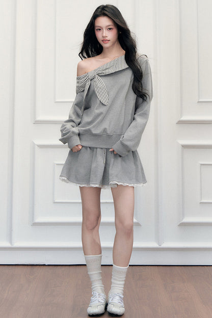 Ensemble sweatshirt épaules dénudées et jupe patchwork à carreaux