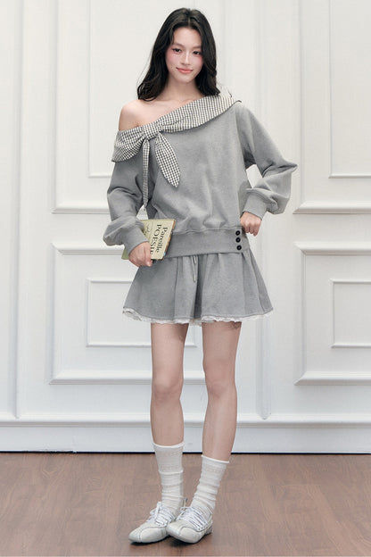Ensemble sweatshirt épaules dénudées et jupe patchwork à carreaux