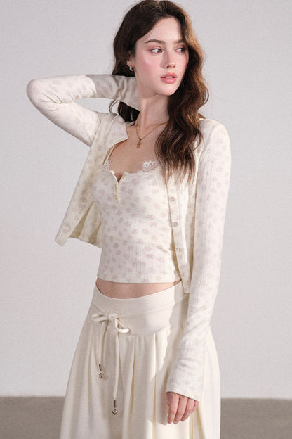 Completo con cardigan smanicato e pantaloni eleganti