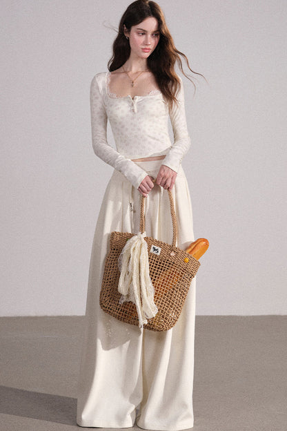 Completo con cardigan smanicato e pantaloni eleganti