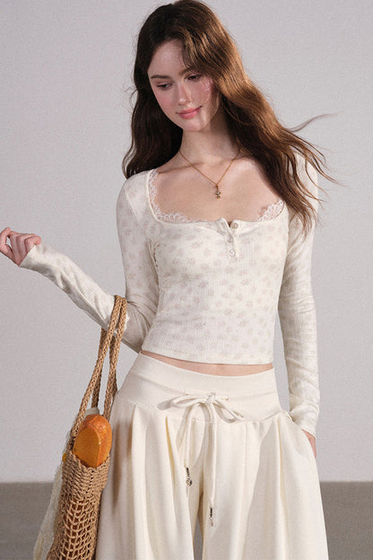 Completo con cardigan smanicato e pantaloni eleganti