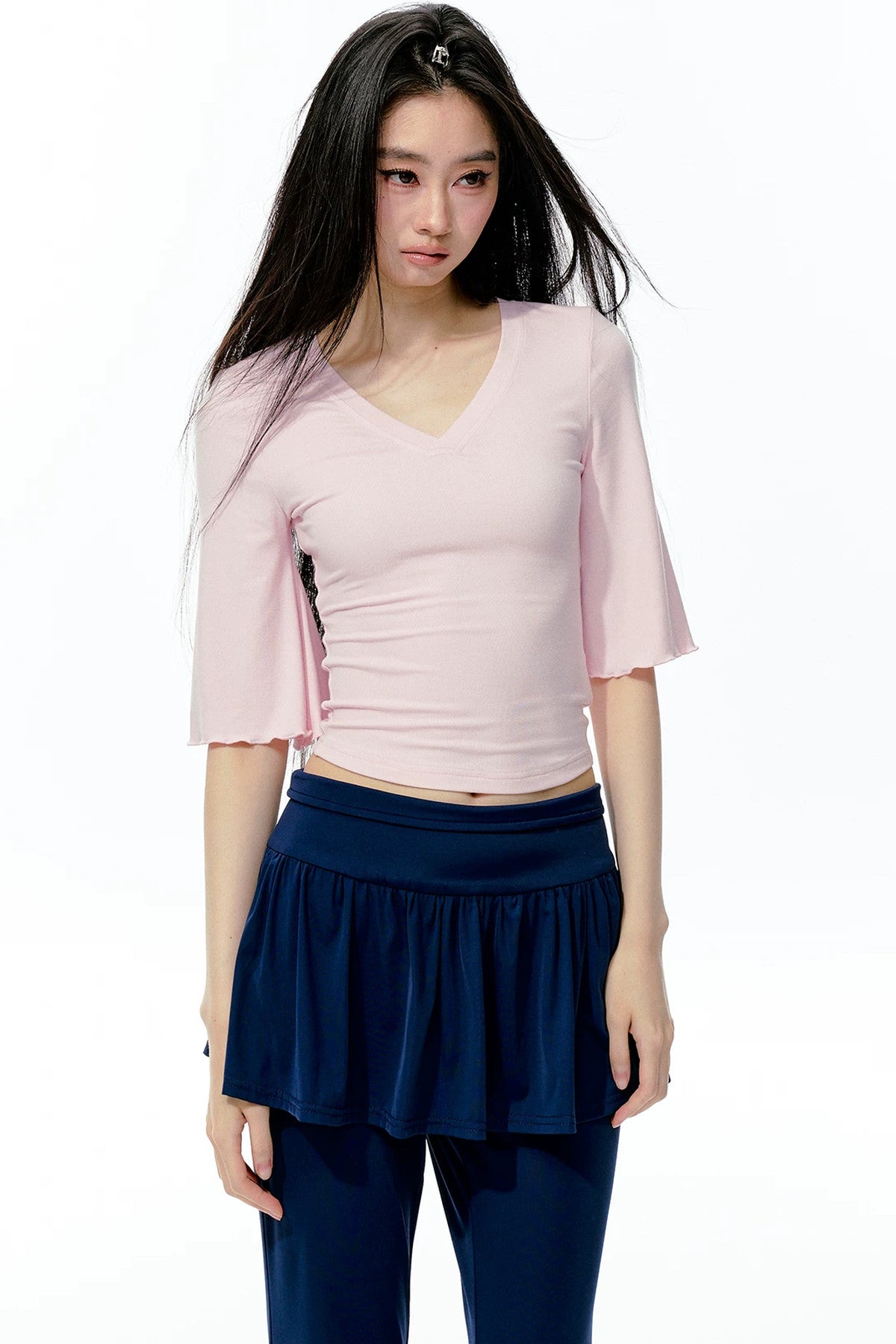 Completo rosa con top a maniche a campana e pantaloni da yoga