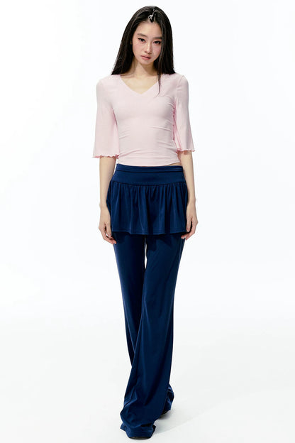 Completo rosa con top a maniche a campana e pantaloni da yoga