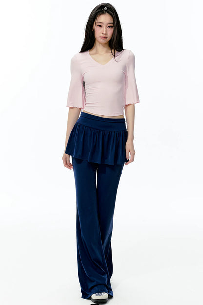 Completo rosa con top a maniche a campana e pantaloni da yoga